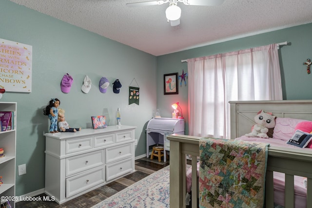 8609 Kenosha Dr, Lubbock, TX 79423 - bedroom featuring a textured ceiling, dark wood-style flooring, baseboards, and a ceiling fan