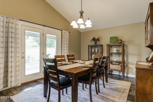 8609 Kenosha Dr, Lubbock, TX 79423 - dining space featuring lofted ceiling, a chandelier, and dark wood-style flooring