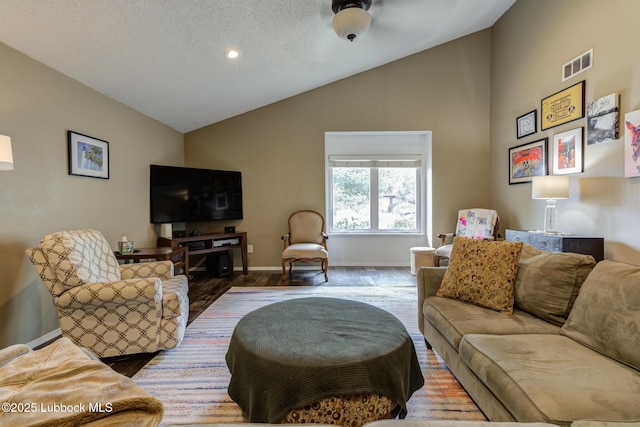 8609 Kenosha Dr, Lubbock, TX 79423 - living room featuring wood finished floors, baseboards, high vaulted ceiling, a textured ceiling, and recessed lighting