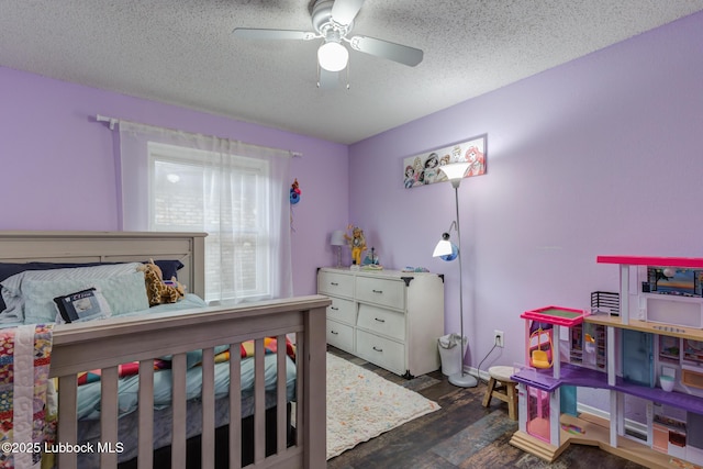 8609 Kenosha Dr, Lubbock, TX 79423 - bedroom featuring wood finished floors, a textured ceiling, and ceiling fan