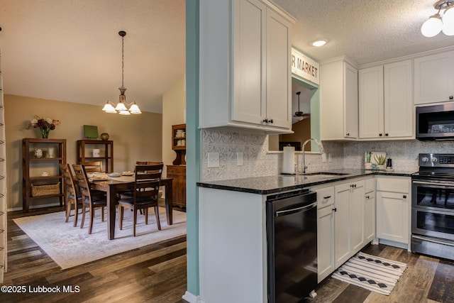 8609 Kenosha Dr, Lubbock, TX 79423 - kitchen featuring black appliances, a sink, dark wood-style floors, backsplash, and white cabinetry
