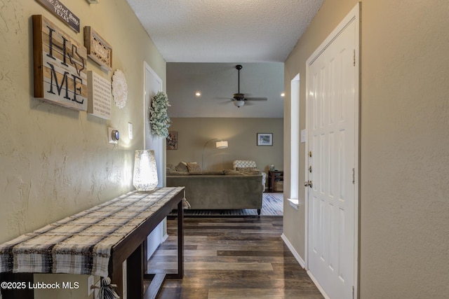 8609 Kenosha Dr, Lubbock, TX 79423 - hall featuring wood finished floors, a textured ceiling, and a textured wall