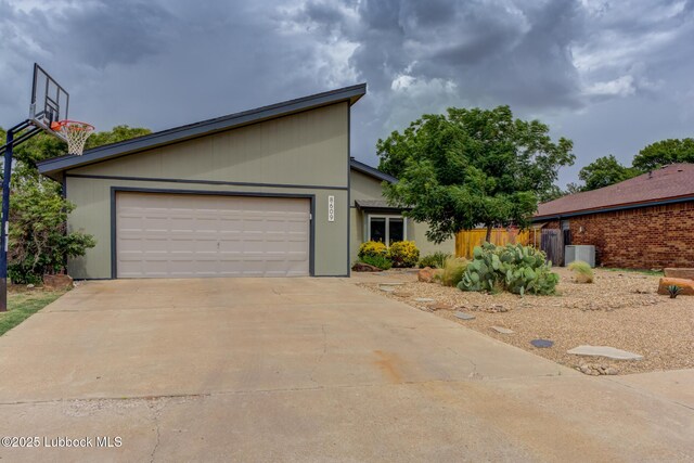 8609 Kenosha Dr, Lubbock, TX 79423 - view of front of property with concrete driveway and a garage