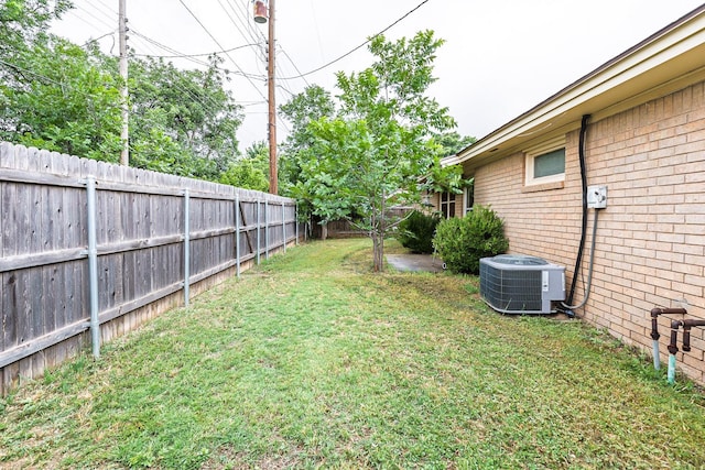 view of yard featuring central AC