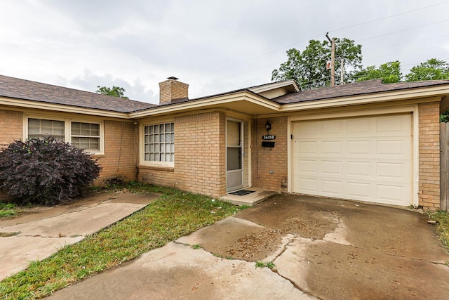 single story home featuring a garage