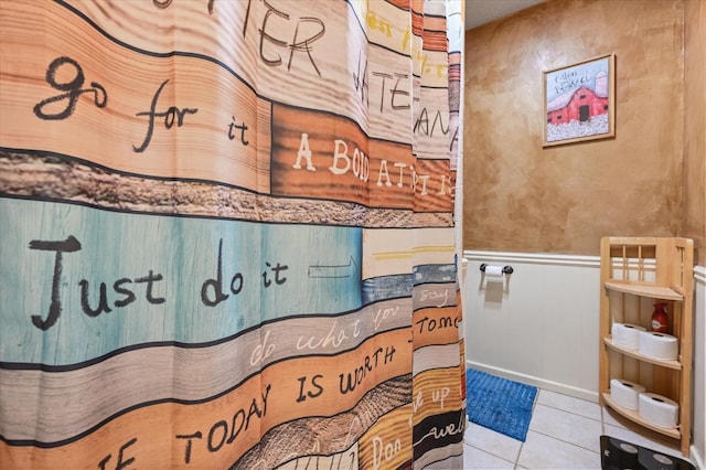 bathroom featuring walk in shower and tile patterned floors