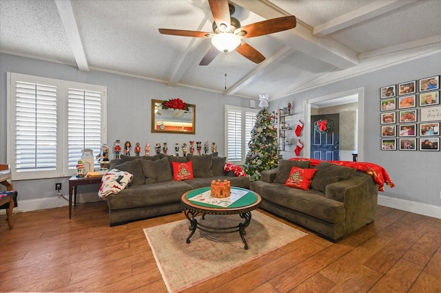 living room featuring hardwood / wood-style floors, lofted ceiling with beams, a textured ceiling, and ceiling fan