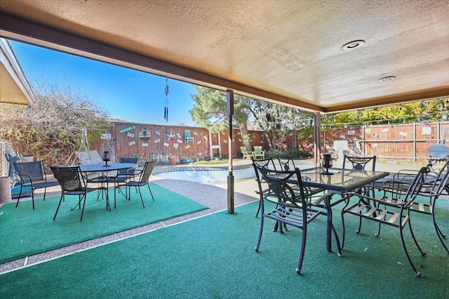 view of patio featuring a community pool