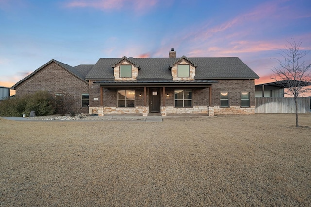 view of front of home with a yard