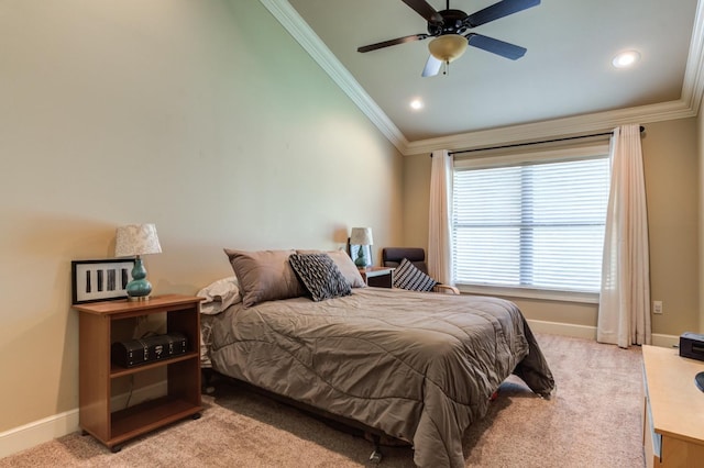 carpeted bedroom with lofted ceiling, ornamental molding, and ceiling fan