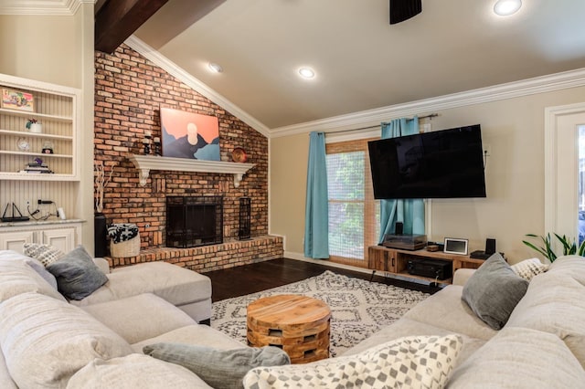 living room featuring built in shelves, crown molding, lofted ceiling with beams, a brick fireplace, and hardwood / wood-style floors