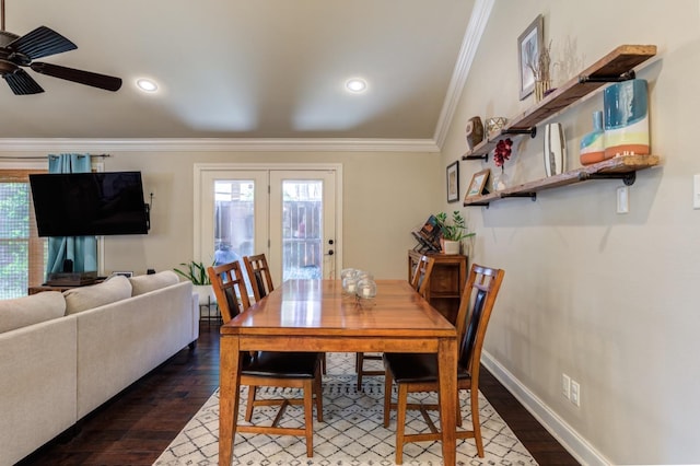 dining space with ornamental molding, ceiling fan, and dark hardwood / wood-style flooring