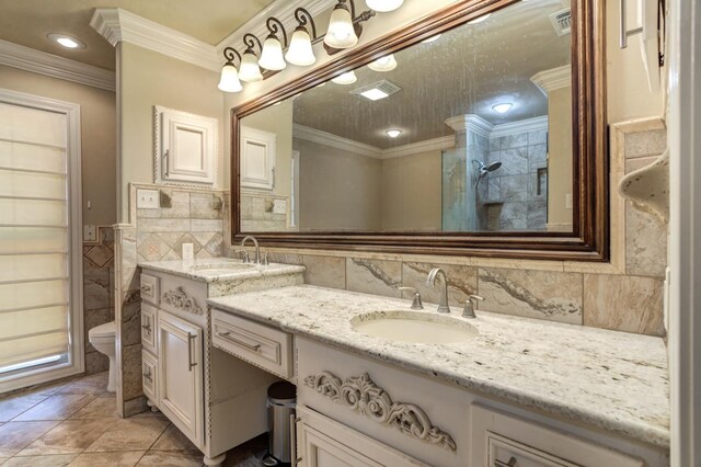 bathroom with ornamental molding, toilet, tile walls, and vanity