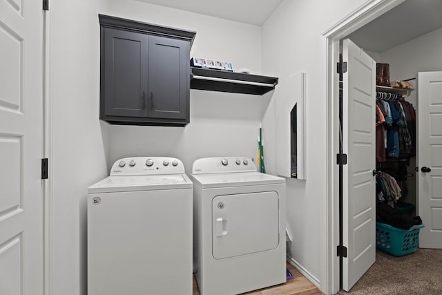 3615 121st St, Lubbock, TX 79423 - laundry room featuring cabinet space, washing machine and clothes dryer, and light carpet