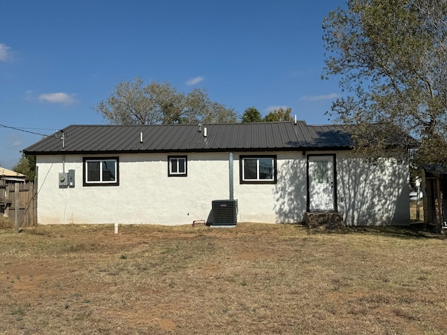 back of house with a yard