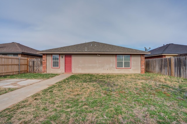 rear view of house with a yard