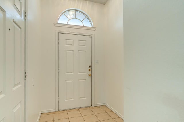 entryway featuring light tile patterned flooring