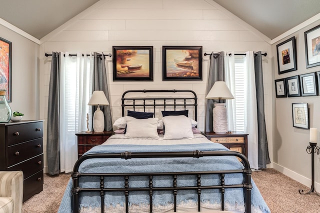 bedroom with ornamental molding, lofted ceiling, and light carpet