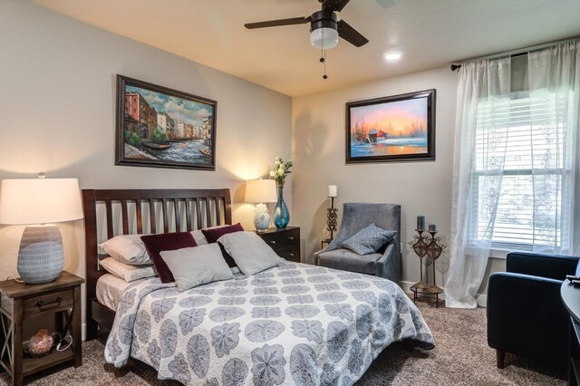 bedroom with ceiling fan and carpet