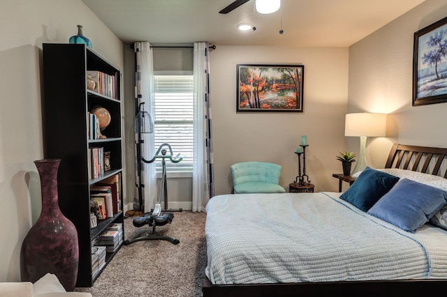 bedroom with ceiling fan and carpet