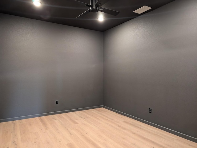 unfurnished room with hardwood / wood-style flooring and ceiling fan