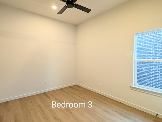 unfurnished room featuring ceiling fan and light hardwood / wood-style floors