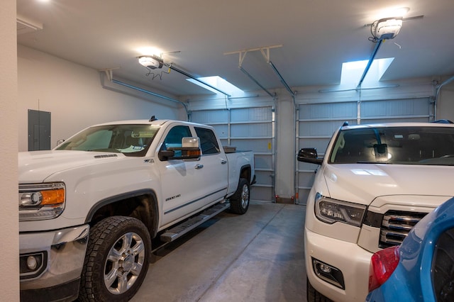 garage featuring a garage door opener and electric panel