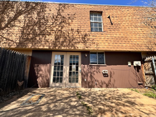 back of property with a patio and french doors