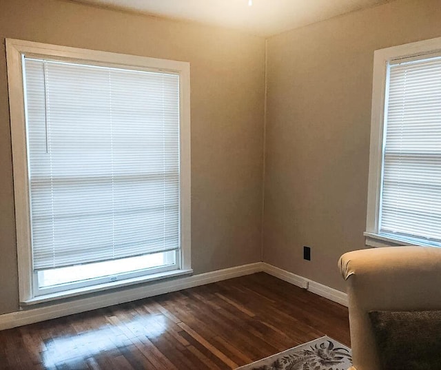 2003 30th St, Lubbock, TX 79411 - unfurnished room featuring baseboards and dark wood-style floors