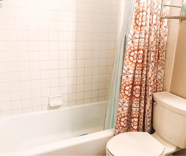 2003 30th St, Lubbock, TX 79411 - full bathroom featuring toilet and shower / bath combination with curtain