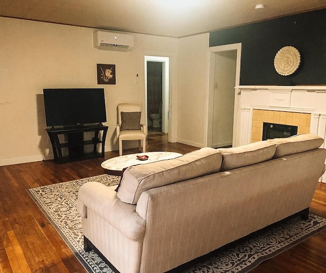 2003 30th St, Lubbock, TX 79411 - living area with a wall unit AC, wood finished floors, and a tiled fireplace
