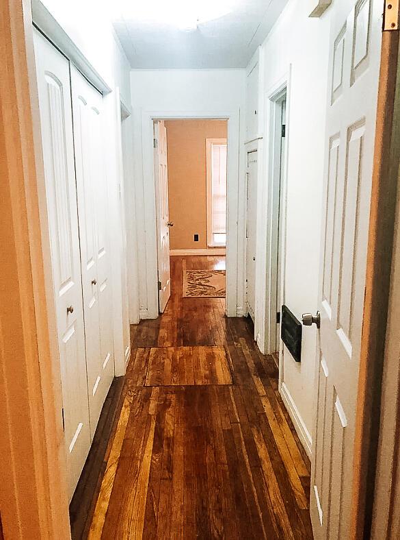 2003 30th St, Lubbock, TX 79411 - hallway with dark wood-style flooring