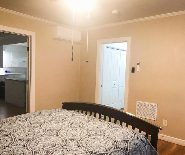 2003 30th St, Lubbock, TX 79411 - bedroom with dark wood finished floors, ornamental molding, and a wall unit AC