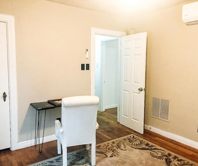 2003 30th St, Lubbock, TX 79411 - office with a wall mounted air conditioner and wood finished floors