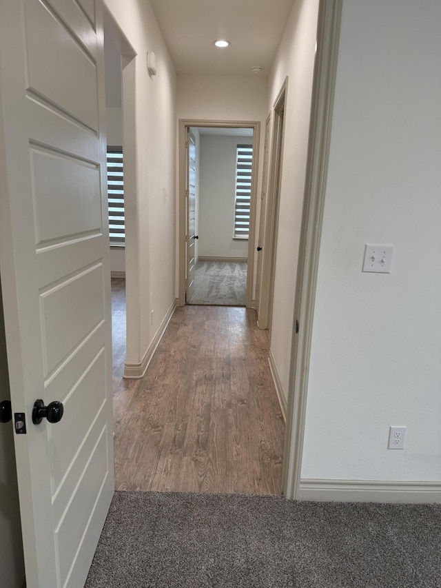 5414 112th St, Lubbock, TX 79424 - hall with wood finished floors, baseboards, and carpet