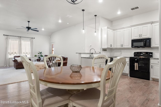 5522 Lehigh St, Lubbock, TX 79416 - dining room with light wood-style floors, ceiling fan, and recessed lighting