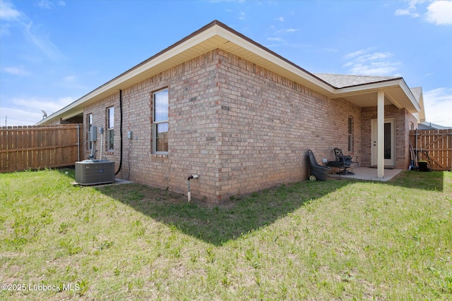 5522 Lehigh St, Lubbock, TX 79416 - view of side of home with a fenced backyard, a patio area, and brick siding