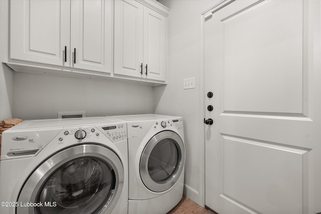 5522 Lehigh St, Lubbock, TX 79416 - laundry area featuring cabinet space, washer and clothes dryer, and light wood-type flooring