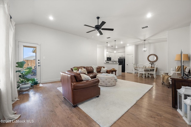 5522 Lehigh St, Lubbock, TX 79416 - living area with ceiling fan, vaulted ceiling, wood finished floors, and recessed lighting