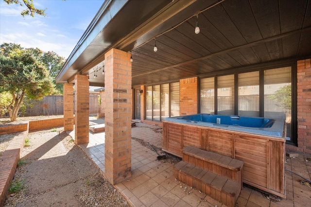 view of patio with a hot tub