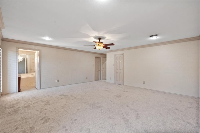 spare room with light carpet, crown molding, and ceiling fan