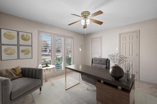 office area featuring ceiling fan and carpet flooring