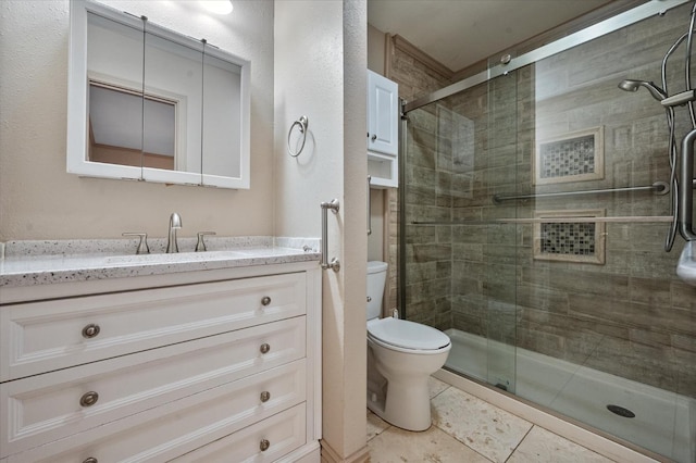 bathroom with walk in shower, tile patterned floors, vanity, and toilet