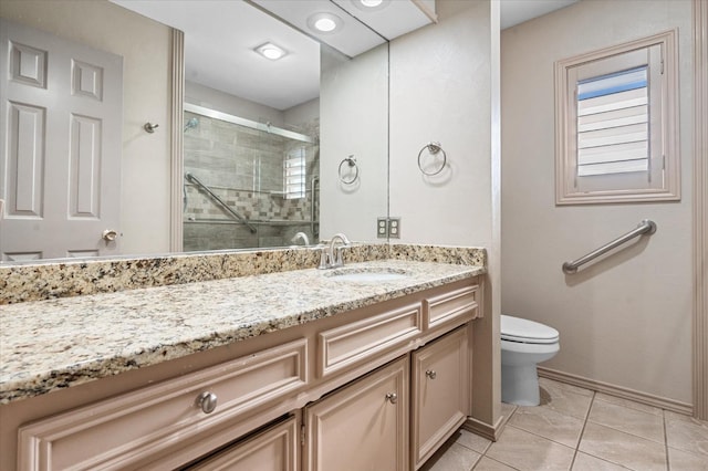 bathroom with tile patterned flooring, walk in shower, vanity, and toilet