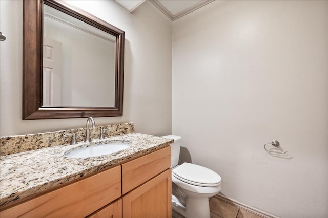 bathroom featuring vanity, tile patterned floors, and toilet