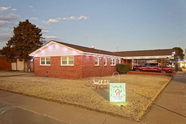 ranch-style house with a carport