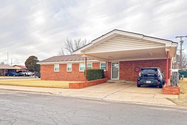 view of front of property with a carport