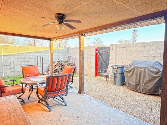 view of patio / terrace with ceiling fan and area for grilling