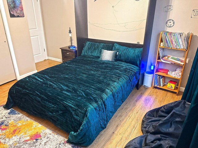 bedroom featuring wood-type flooring