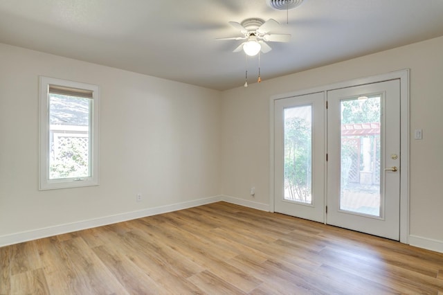 unfurnished room featuring ceiling fan and light wood-type flooring